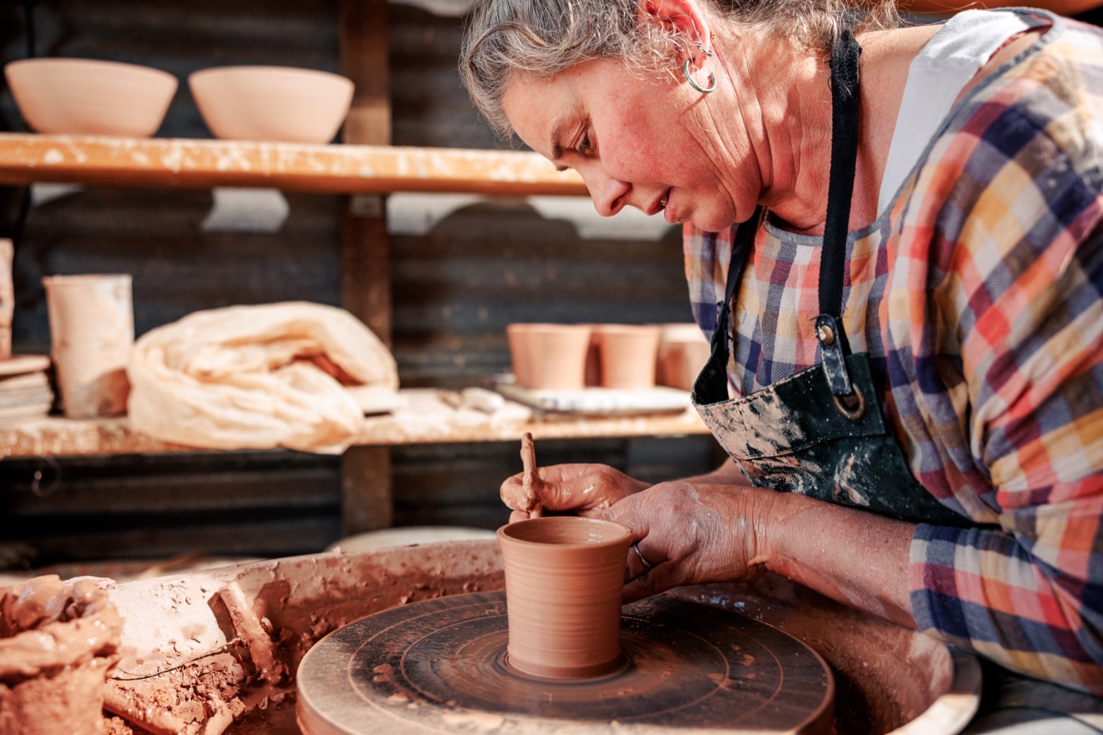 Jennifer Hodges at the pottery wheel, Woolshed Ceramics