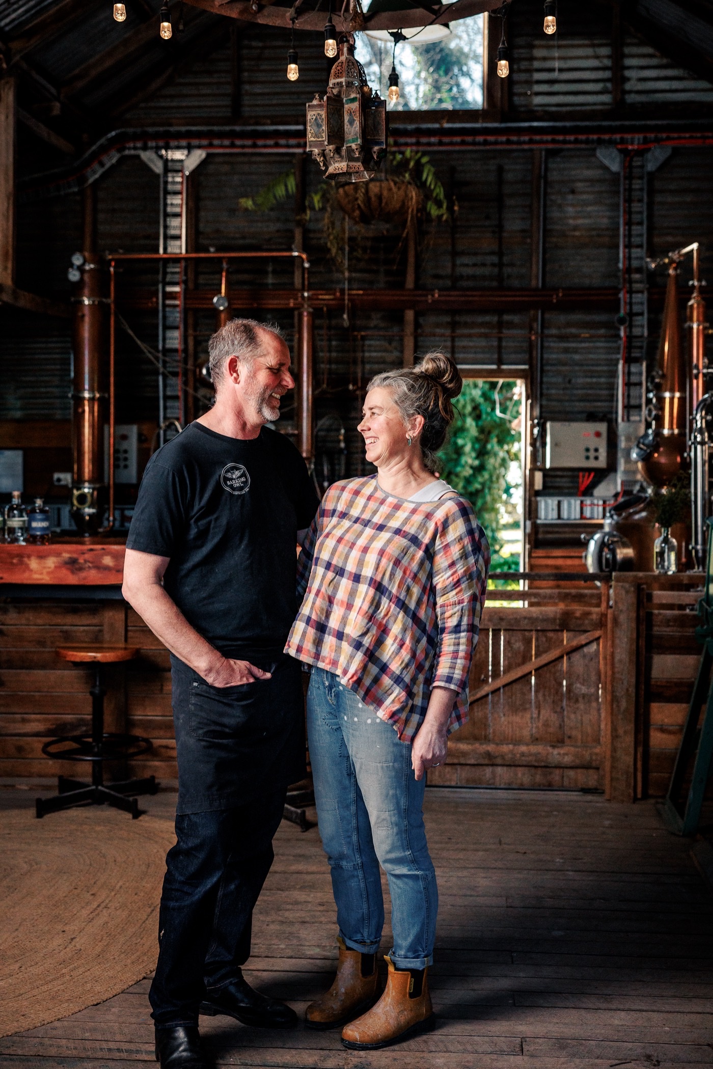 Dave and Jen, founders of Barking Owl Distilling Co., in the shed